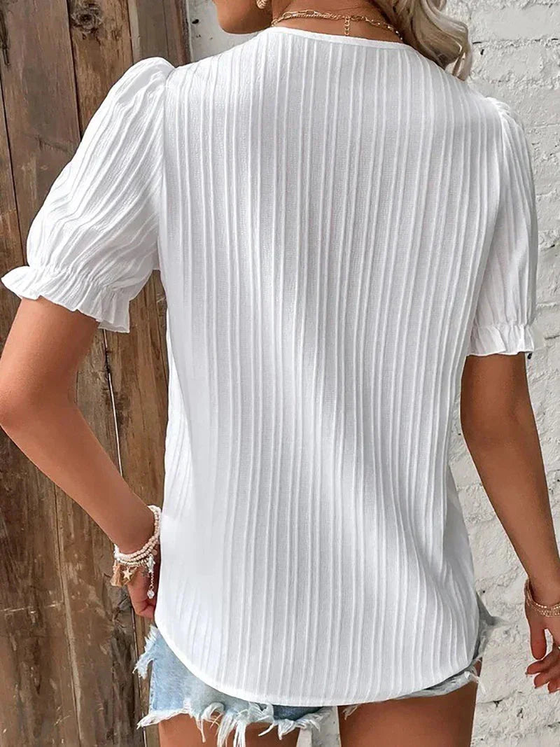 Elegant Women's Blouse with Delicate Details