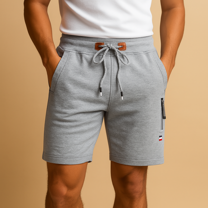 Breathable athletic shorts for men with multiple pockets and elastic waistband, ideal for sports, travel, and everyday comfort.