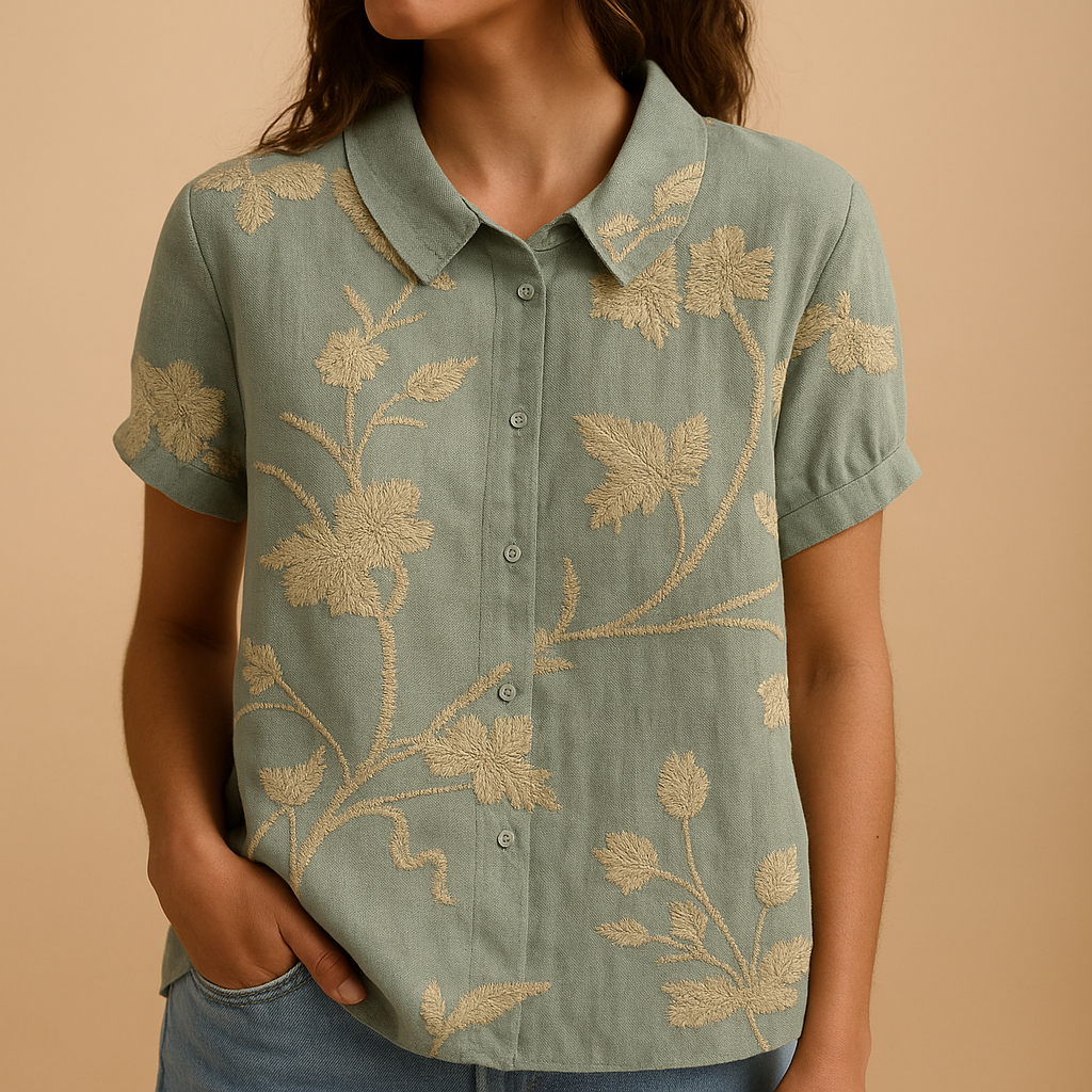 Women’s floral blouse with relaxed fit and breathable fabric, featuring a multicolor flower print for casual and warm-weather outfits.