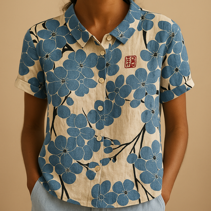 Women’s floral blouse with relaxed fit and breathable fabric, featuring a multicolor flower print for casual and warm-weather outfits.