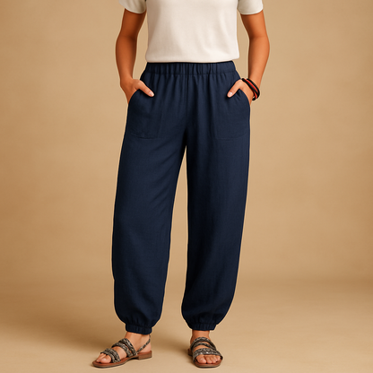 High-waisted boho summer trousers for women with a loose flowing fit and functional pockets, ideal for beach days, travel, and relaxed summer outfits.