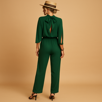 Woman wearing a light summer jumpsuit with adjustable straps, an airy fit, and pockets, perfect for beach days, casual outings, and warm evenings.
