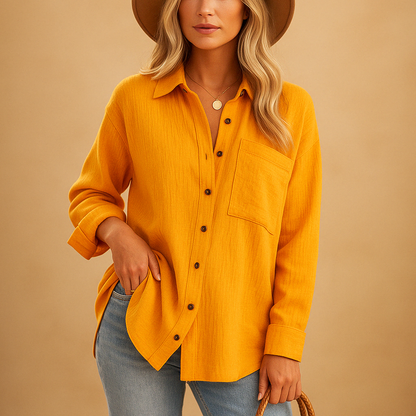 Women’s long sleeve polo shirt with a relaxed fit, classic collar, button closure, and chest pocket, suitable for work and casual everyday wear.
