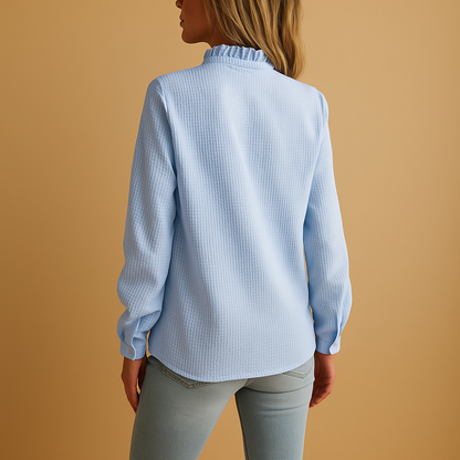 Women’s striped blouse with ruffles, soft fabric, and a feminine tailored fit, ideal for casual and dressed-up outfits.